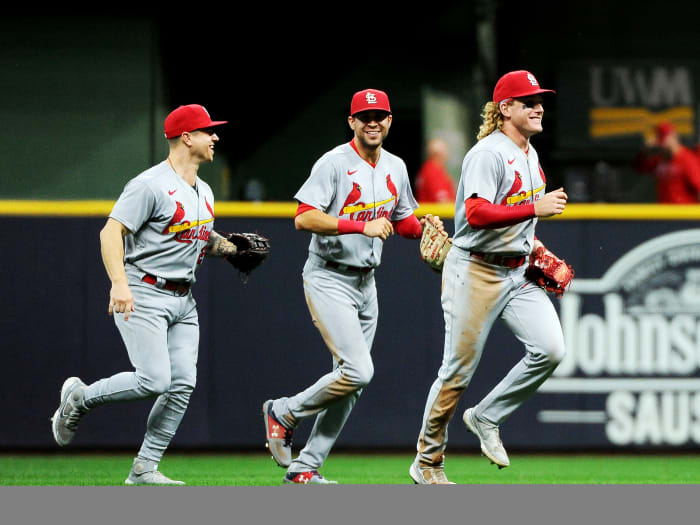 Sep 20, 2021; Milwaukee, Wisconsin, USA; St. Louis Cardinals left fielder Tyler O'Neill (27) and right fielder Dylan Carlson (3) and center fielder Harrison Bader (48) celebrate after defeating the Milwaukee Brewers at American Family Field.